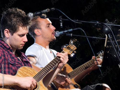 Photo: Two guitar players Two guitar players