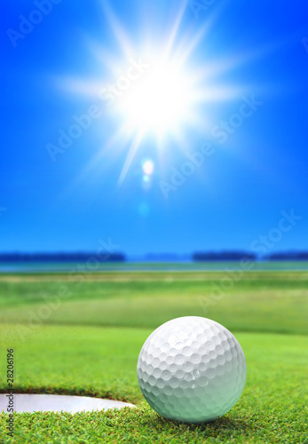 Photo: golf ball on green course golf ball on green course