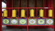 Bronze prayer wheel spinning in the Lama Temple Bronze prayer wheel spinning in the Lama Temple