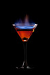 Flaming cocktail over black Flaming cocktail over black