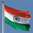 flag of India with flag pole waving in the wind over blue sky flag of India with flag pole waving in the wind over blue sky