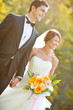 happy bride and groom at a park on their wedding day happy bride and groom at a park on their wedding day