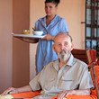 elderly senior man with carer