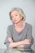 Senior woman with unconcerned expression
