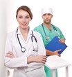 Photo: Portrait of doctor with her colleague in the background. Portrait of doctor with her colleague in the background.