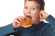 Young boy deciding to eat a donut