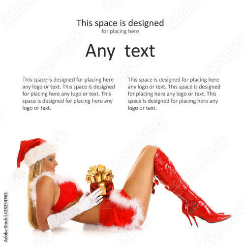 Photo: A young and sexy female is lying in a Santa costume A young and sexy female is lying in a Santa costume
