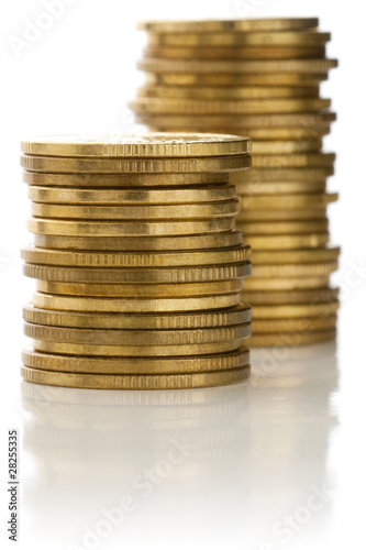 Photo: Stacks of golden coins. Stacks of golden coins.