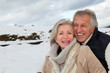 Photos : Portrait of happy senior couple at the mountain