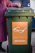 A senior woman recycling spectacles