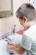 Boy washing hands