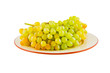 Grapes on plate. Isolated on white