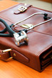 ����: Doctor's case with stethoscope against wooden background � Elnur #28269149