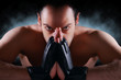 Mma fighter concentrating, staring , dramatic lighting