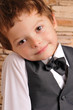 boy in a suit and bow tie boy in a suit and bow tie