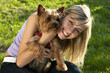 Young woman holding dog