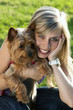 Young woman holding dog