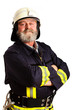 Feuerwehrmann mit Vollbart, in die Kamera blickend