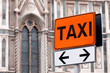 Taxi rank sign with Italian church in background Taxi rank sign with Italian church in background