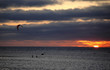 Kite-surfers at sundown