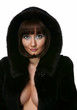 The sexy girl in a fur coat on a white background The sexy girl in a fur coat on a white background