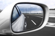 Landscape in the mirror of a car
