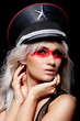 Photo: Head shot of a woman wearing peaked cap with a cockade Head shot of a woman wearing peaked cap with a cockade