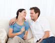 Beautiful woman holding a rose with her boyfriend at home
