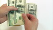 man counting dollars on white background