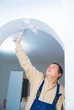 worker paint the arc, make home renovation indoor. worker paint the arc, make home renovation indoor.