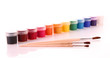 Raw of gouache cans and brushes isolated on white
