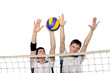 Photo: Volleyball players with the ball on a white Volleyball players with the ball on a white