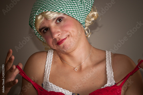 Photo: A man dressed as a woman choosing bra A man dressed as a woman choosing bra