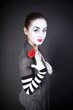 Woman pantomime with a red flower