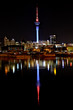 Auckland City night lights reflect on harbor Auckland City night lights reflect on harbor