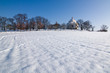 Village chapel in winter countryside