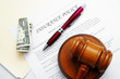 insurance policy with legal gavel and dollar bill insurance policy with legal gavel and dollar bill