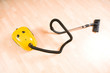 Vacuum cleaner on the polished wooden floor Vacuum cleaner on the polished wooden floor