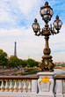 Street lantern on the Alexandre III Bridge against the Eiffel To