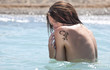 Being covered, in water