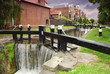 artificial waterfall and river. small houses made of red brick artificial waterfall and river. small houses made of red brick