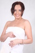 A young woman wrapped in a bath towel