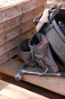 Construction workers tool belt next to some concrete forms Construction workers tool belt next to some concrete forms