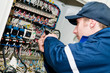 Electrician at voltage adjusting work Electrician at voltage adjusting work