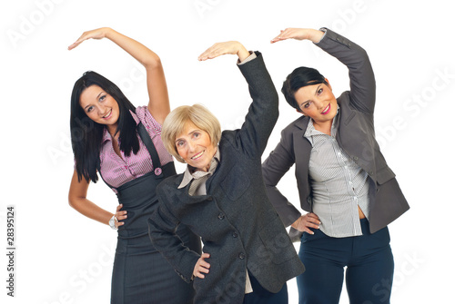 Photo: Active businesswomen stretching hands Active businesswomen stretching hands