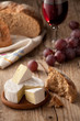 Traditional Normandy Camembert cheese with homemade bread, glass Traditional Normandy Camembert cheese with homemade bread, glass