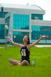 The beauty wet brunette on the grass The beauty wet brunette on the grass
