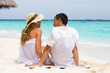 A happy young couple on a beach A happy young couple on a beach