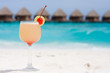 Cocktail on a beach with red cherry Cocktail on a beach with red cherry