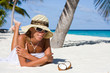 A lady is relax on a tropical beach A lady is relax on a tropical beach